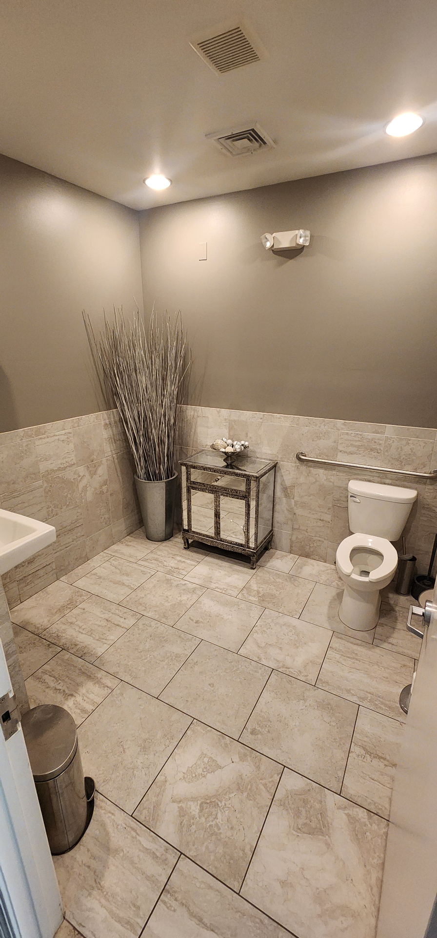 Tiled client restroom with professional finishes
